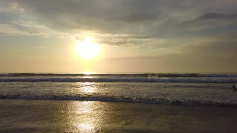 Kids playing in the waves during sunset, Bali, HD Stock Footage 158590987