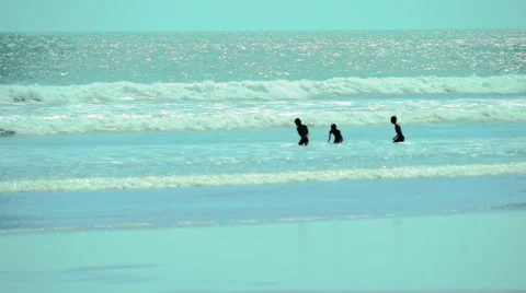 Kids Playing in Waves Stock Footage 49441965