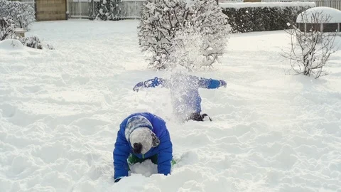 Kids playingon the snow Stock Footage 87084335