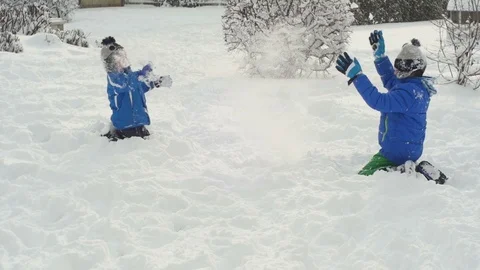 Kids playingon the snow Stock Footage 87084567