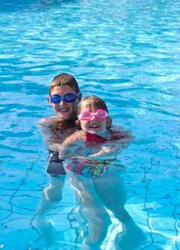 Kids in the pool Stock Photos