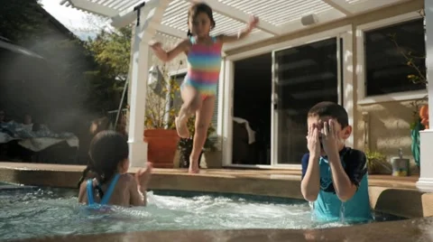KIDS IN POOL SPLASH LENS Stock Footage 54621892
