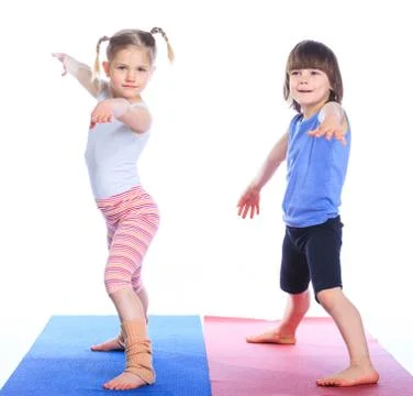 Kids practice yoga Stock Photos