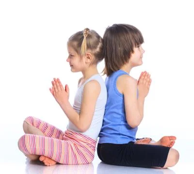 Kids practice yoga Stock-Fotos