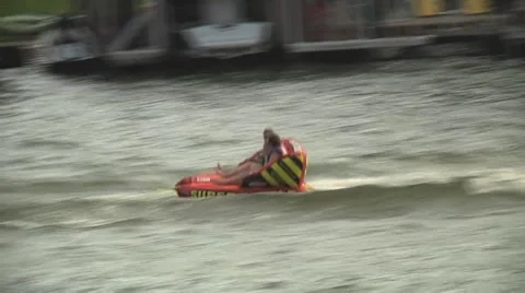 Kids pulled by boat on lake Stock Footage 39963167