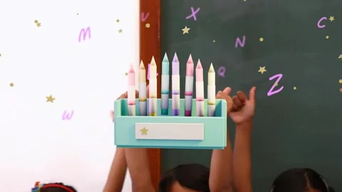 Kids raising thumbsup causing teal box rising and filling with pastel crayons, Stock Footage 339494831