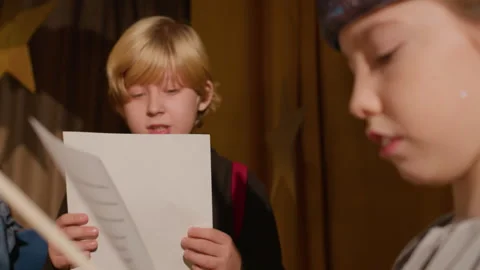 Kids Reading Play Script in Theatre Stock Footage 303061245