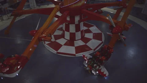 Kids ready to get aboard flying planes in the amusement park Stock Footage 283285073