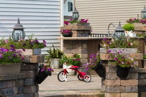 Kids red tricycle in a courtyard Stock Photos