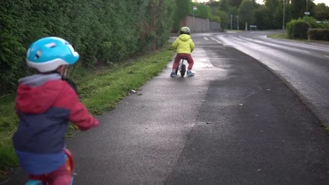 Kids riding balance bikes Stock Footage 80921535