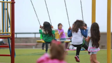 Kids riding on a swing Stock Footage 63906102
