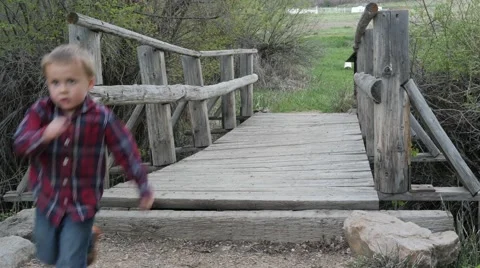 Kids running across bridge Stock Footage 49685448
