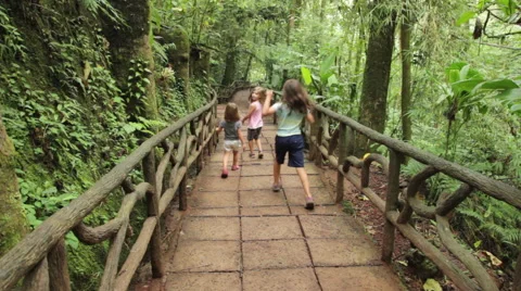Kids Running down Path Through Jungle Stock Footage 60951991