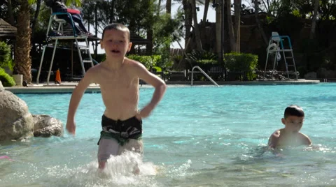 Kids running out of pool in slow motion Stock Footage 62477918