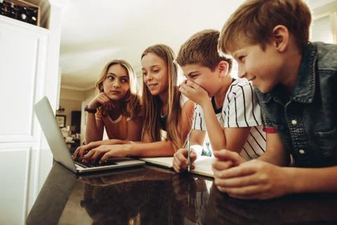 Kids sharing knowledge using technology Stock Photos