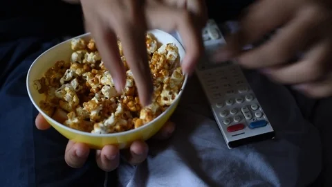 Kids sharing popcorn while watching movies Video stock 83211477