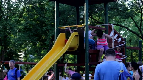 Kids On A Slide, Playing Having Fun, Summer Afternoon, Park, Still Shot Stock Footage 50956547