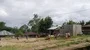 Kids in small indonesia mountain village playing football soccer on dirty field 4k or 4k+ Resolution
