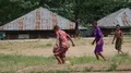 Kids in small indonesia mountain village playing football soccer on dirty field 4k or 4k+ Resolution