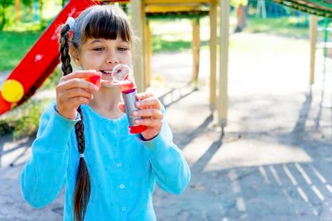 Kids with soap bubbles Stock Photos