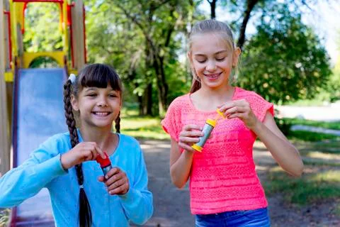Kids with soap bubbles Stock Photos