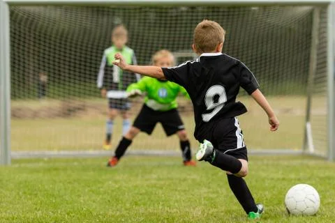 Kids soccer penalty kick Stock Photos