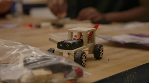 Kids in STEM class making robot cars Stock Footage 283586834