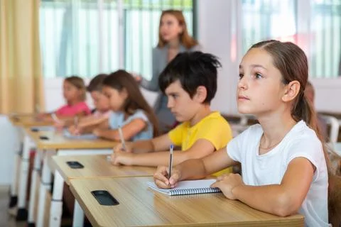 Kids studying in classroom Stock Photos
