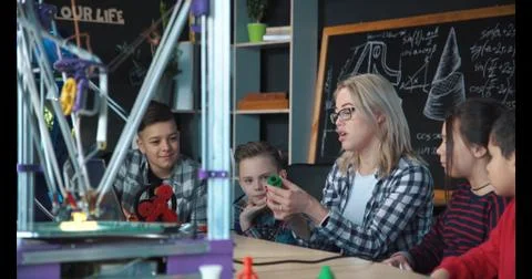 Kids studying process of 3d printing Stock Photos