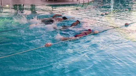 Kids at swimming pool, class learning to swim Stock Footage 144093667