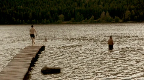 Kids swimming,old film tint Stock Footage