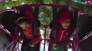 Kids On Swing In Amusement Park Stock Footage