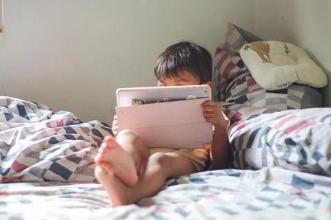 Kids with tablet computer. Child with pc watching movie or playing game. Ed.. Stock Photos