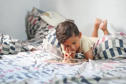 Kids with tablet computer. Child with pc watching movie or playing game. Bo.. Stock Photos