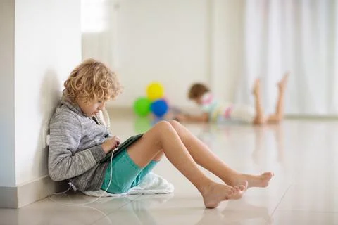Kids with tablet computer. Child playing game. Stock Photos