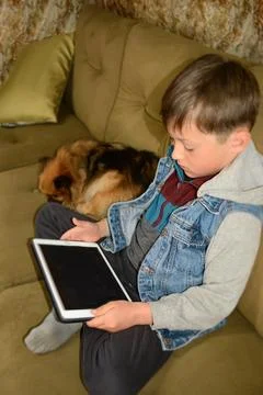 Kids with tablet computer. A mockup of a tablet in the hands of a child. Ed.. Stock Photos