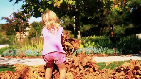 Kids throw Fall leaves-MVI 6365 Stock Footage 9281934