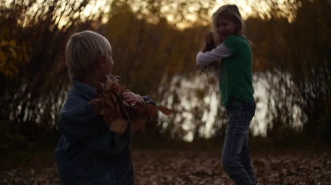 Kids Throwing Leaves Stock Footage 56601560