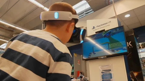 Kids try Virtual Reality with Sony  Playstation VR April 2019 Stock Footage 108774440