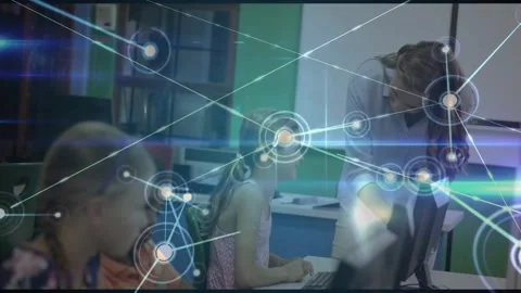 Kids typing and activating network overlay across computer lab while teacher Stock Footage 330662365