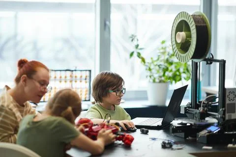 Kids using 3D Printer in Robotics Laboratory Stock Photos