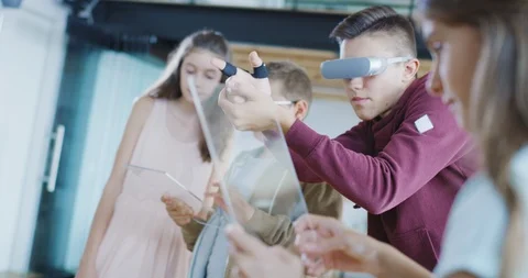 Kids Using Futuristic Technology To Play Games In A High Tech Classroom Future Stock Footage 100736849