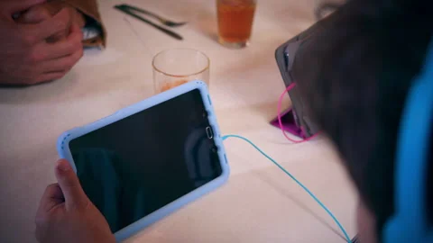 Kids watching tv on tablets Stock Footage 298075012