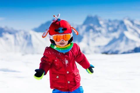Kids winter snow sport. Children ski. Family skiing. Stock Photos