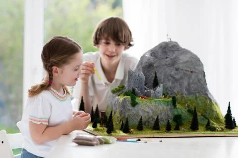 Kids working on model building project for school Fotos de archivo