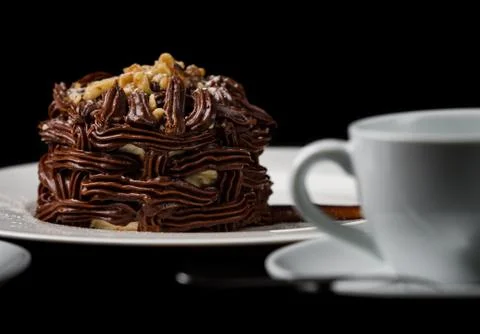 Kiev cake with nuts and chocolate. Close-up photography in a restaurant. Swee Stock Photos