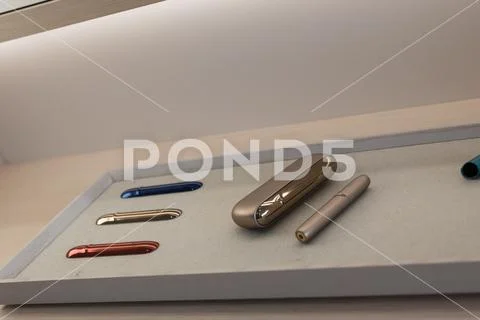 Kiev, Ukraine - January 17, 2019: New design IQOS. Showcase with a large multi Stock Photos