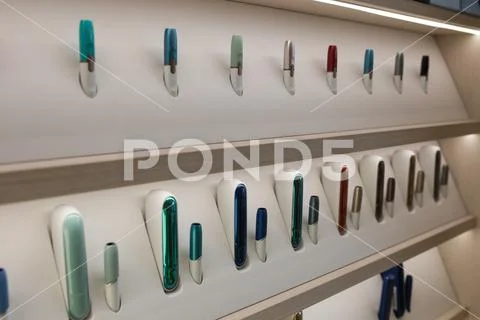 Kiev, Ukraine - January 17, 2019: New design IQOS. Showcase with a large multi Stock Photos
