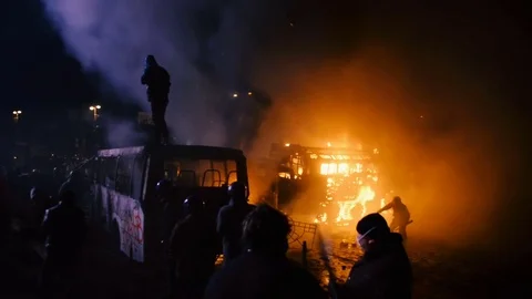 Kiev, Ukraine, January 2014: Protesters throw stones at police during protests Stock Footage