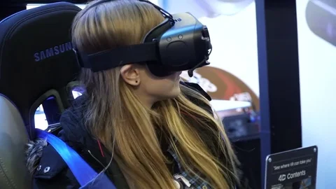 Kiev, Ukraine, October 7, 2017: A girl with virtual reality glasses is Video stock 80963592